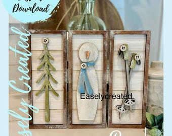 May include: Three wooden framed winter-themed wall art pieces. One features a green tree, another a snowman with a blue scarf, and the last, a pair of skis. The text "Easely Created" is visible.