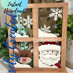 May include: A wooden window frame with a Santa Claus and reindeer cutout design. The window frame is decorated with snowflakes and a snowy background. The text "Easelcreated" is visible in the window frame.