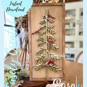 May include: A wooden sign with a gold tree and red birds. The sign is framed in a brown wood frame and has the text "Easlycreated" on it.