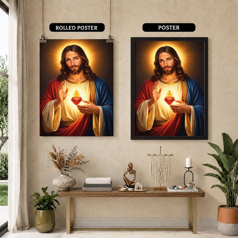 May include: Two wall art displays featuring the Sacred Heart of Jesus. The left image is labeled ROLLED POSTER and the right image is labeled POSTER. Both show a portrait of Jesus with a glowing heart, wearing red and blue robes, with a golden halo.