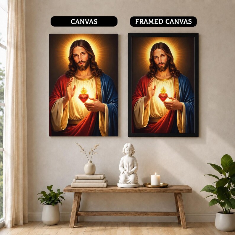 May include: Two wall art displays labeled CANVAS and FRAMED CANVAS featuring a portrait of Jesus Christ with a glowing Sacred Heart. The figure wears a red and blue robe over a cream garment, with a golden halo radiating light behind the head.