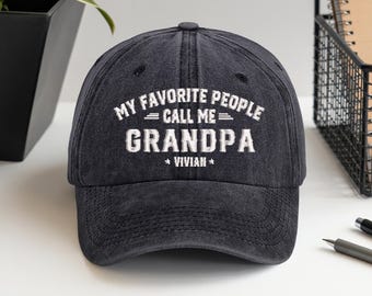 May include: A black baseball cap with the text "MY FAVORITE PEOPLE CALL ME GRANDPA VIVIAN" embroidered in white. The cap has a curved brim and a classic six-panel design, suitable for casual wear.