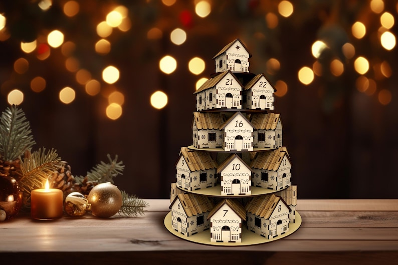 May include: A wooden Christmas advent calendar shaped like a tiered stack of houses. Each house has a number from 7 to 22. The houses are beige with brown roofs and white trim. A candle and ornaments are in the foreground.