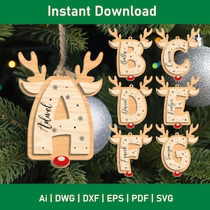 May include: Wooden reindeer-shaped Christmas ornaments, each with a letter and a name. The light brown ornaments have red noses and hang on a Christmas tree. The text "Instant Download" is at the top.