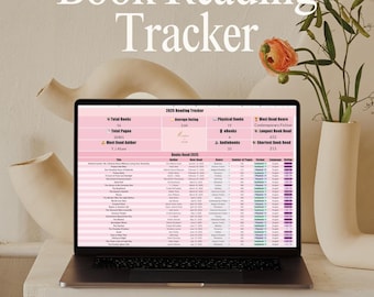 May include: A laptop displaying a pink and white book reading tracker. The screen shows data fields for total books, pages, and reading statistics. The words "Book Reading Tracker" are at the top of the image. Decorative vases and flowers are in the background.
