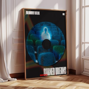 May include: A black and blue poster with the text "MELANCHOLY HOTLINE" and "BURNED DREAMS" in white. The poster features a circular image of a blue and green stadium seating area with a glowing figure in the centre.