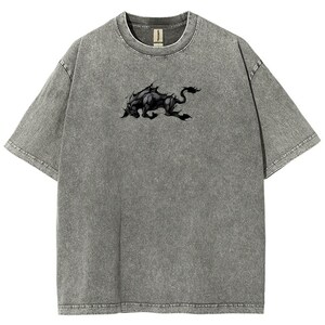 May include: Gray t-shirt with a black graphic of a mythical beast. The shirt has a crew neck and short sleeves. The fabric has a textured, washed appearance.