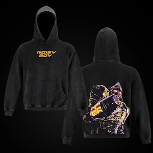 May include: Black hooded sweatshirt with the text "NOISY BOY" in yellow on the front. The back features a graphic of a robot with yellow and purple accents. The sweatshirt has a kangaroo pocket.