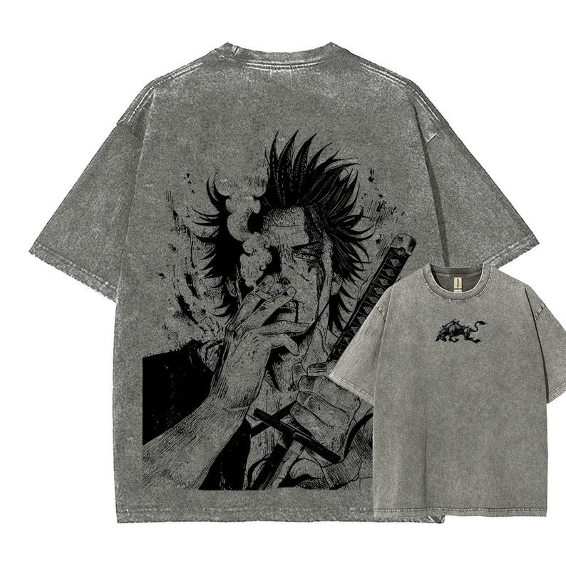May include: Gray t-shirts with a distressed graphic print. The larger shirt features a detailed black and white illustration of a person with a sword and cigarette. A smaller shirt shows a black bull graphic.