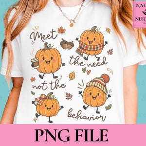 May include: A white t-shirt featuring a graphic print of four cartoon pumpkins with faces. The text reads Meet the need not the behavior. The pumpkins are decorated with a coffee cup, a plaid scarf, a plaid bow, and a knit beanie hat with acorns.