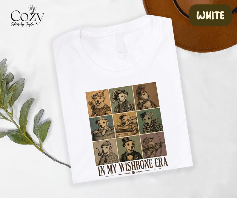 A white t-shirt with a graphic design featuring a collage of nine animal portraits arranged in a 3x3 grid, along with the text "IN MY WISHBONE ERA".