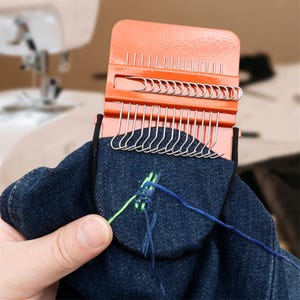 May include: A set of three ceramic mugs with a speckled, matte finish. The mugs are in shades of cream, light gray, and dark gray. Each mug has a simple, minimalist design, perfect for coffee or tea.