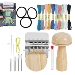 May include: A collection of craft supplies including a weaving loom, embroidery floss in various colors, black hair ties, needles, a wooden mushroom-shaped tool, and a small test tube. The items are for crafting and DIY projects.