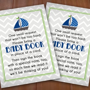 May include: Two gray and white chevron patterned cards with a green border. Each card features a blue sailboat with a white sail and a green flag. The text on the cards reads: "One small request that won't be too hard: Please bring a BABY BOOK in place of a card. Then sign the book with a special note, too, so each time we read it we'll be thinking of you!"