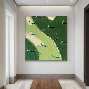May include: A square canvas painting featuring an abstract landscape in shades of dark and light green. The textured surface depicts winding paths in pale cream and light green, populated by small, stylized figures in black and one in red.