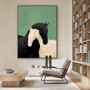 May include: A framed art print featuring two horses. One horse is black, and the other is white, set against a green background. The horses are positioned close together, creating a sense of connection. The artwork is displayed in a modern living space.