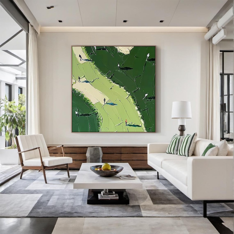 May include: A large square canvas painting featuring an abstract landscape with thick, textured impasto brushstrokes in shades of deep forest green and light lime green, accented by small, dark, silhouetted figures casting long, distinct shadows.