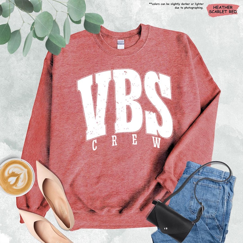 a red sweatshirt with the words vbs crew on it