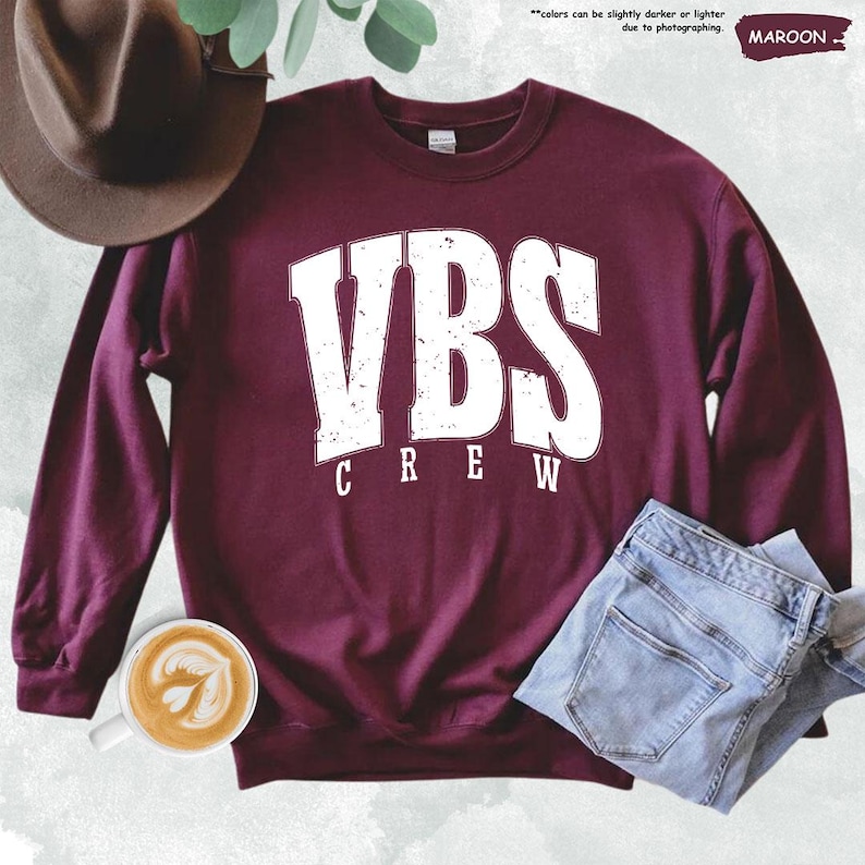 a maroon sweatshirt with the words vbs crew on it