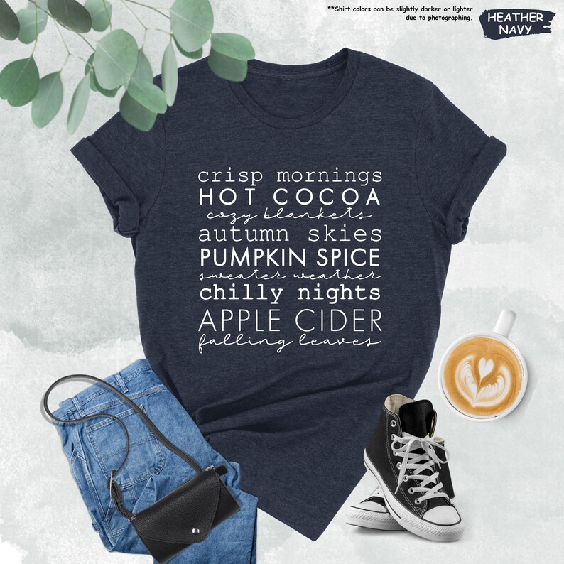 a t - shirt that reads crisp mornings, hot cocoa, autumn skies, pumpkin