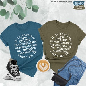 a couple of shirts that are next to a cup of coffee