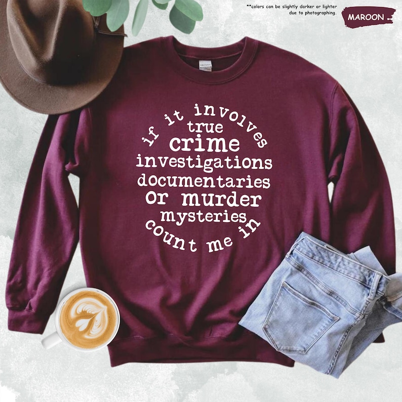a maroon sweatshirt with white writing on it