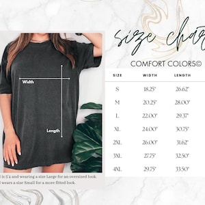 May include: A dark gray Comfort Colors t-shirt with a size chart. The chart lists sizes S to 4XL, with measurements for width, length, and sleeve length in inches. The model is 5'4" and wears a Large for an oversized look.