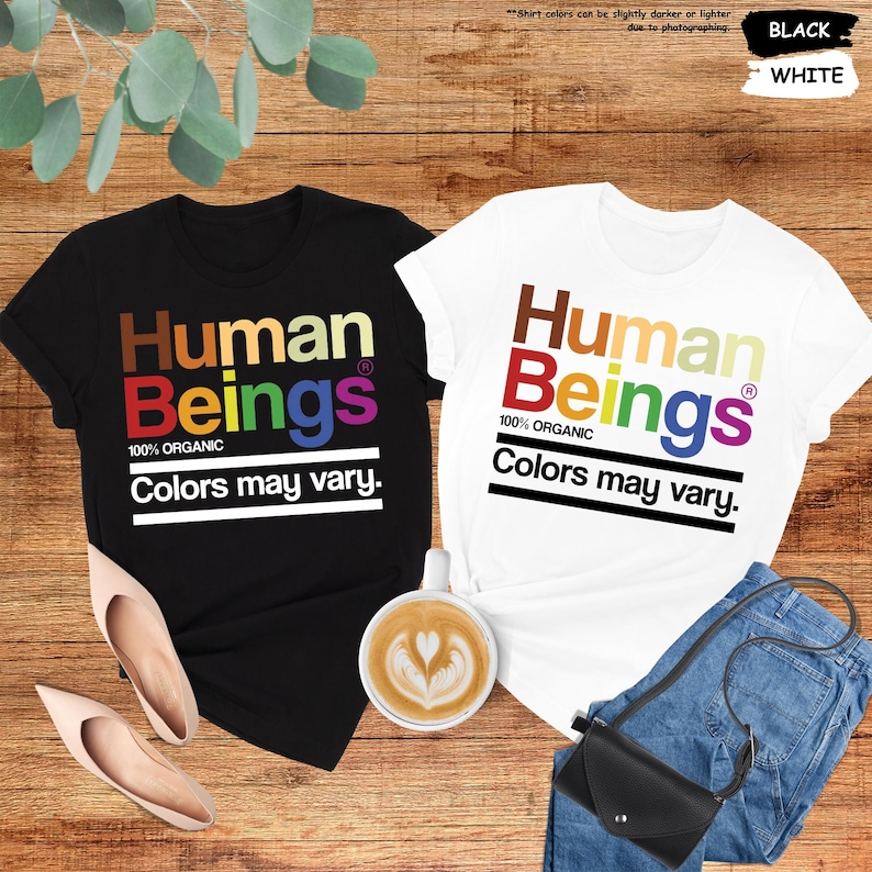 two t - shirts that say human beings and colors may vary