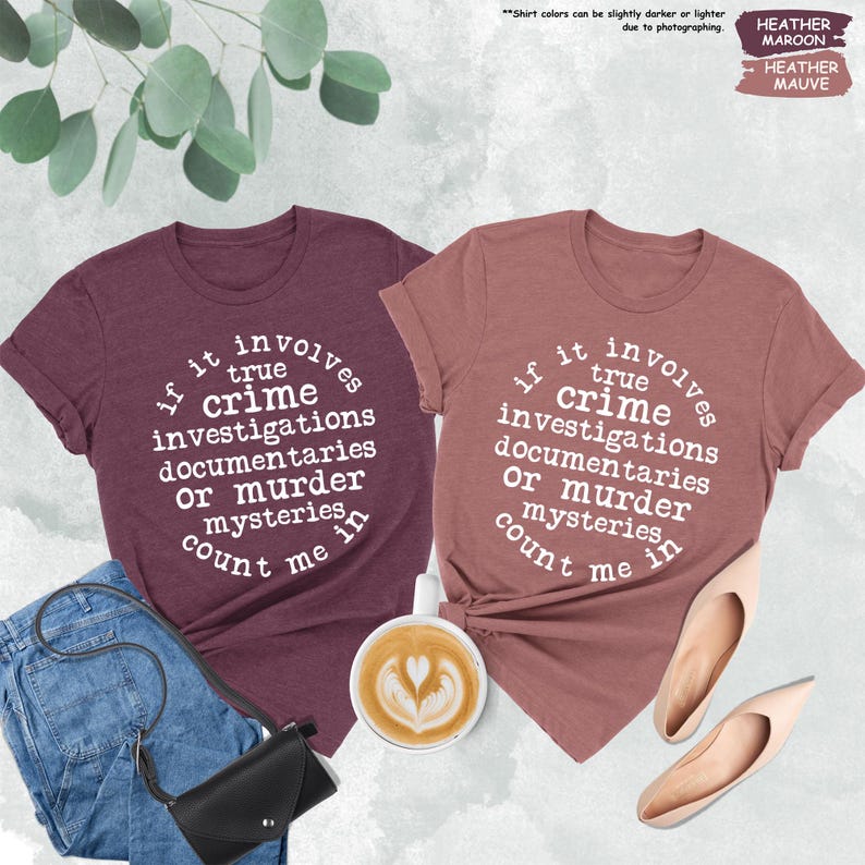 a couple of t - shirts that are on a table