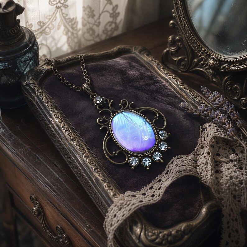 a necklace with a blue stone pendant, resting on a wooden surface.