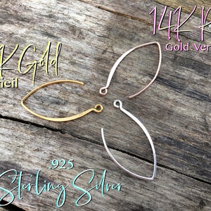May include: Three earring wires in different finishes: 14K gold vermeil, 14K rose gold vermeil, and sterling silver. The wires are all the same shape, a slightly curved oval.
