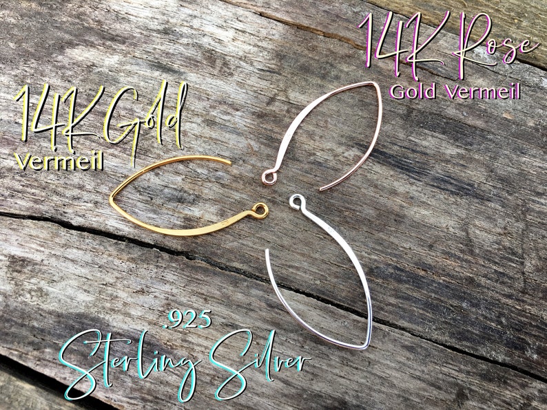 May include: Three earring wires in different finishes: 14K gold vermeil, 14K rose gold vermeil, and sterling silver. The wires are all the same shape, a slightly curved oval.