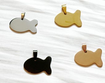 May include: Four fish-shaped pendants in silver, gold, black, and rose gold. Each pendant has a small loop at the top for a chain. The pendants are displayed on a white, textured surface.