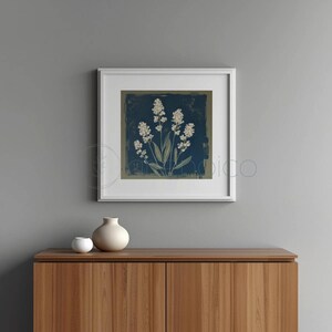 Stylized botanical painting featuring slender olive-green leaves and textured white flowers on a dark moody background. Square format digital art with a vintage aesthetic, perfect for modern farmhouse or cottagecore wall decor.