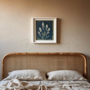 Stylized botanical painting featuring slender olive-green leaves and textured white flowers on a dark moody background. Square format digital art with a vintage aesthetic, perfect for modern farmhouse or cottagecore wall decor.