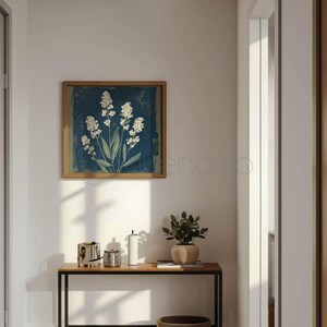 Stylized botanical painting featuring slender olive-green leaves and textured white flowers on a dark moody background. Square format digital art with a vintage aesthetic, perfect for modern farmhouse or cottagecore wall decor.