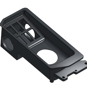 May include: A black, rectangular plastic component with a tray-like design. It features a series of rectangular and circular openings, along with a protruding section with mounting holes. The design suggests a mechanical or electronic part.