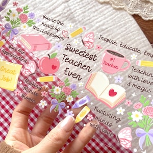 May include: A clear sticker sheet with teacher-themed illustrations and text. The design includes phrases such as "Sweetest Teacher Ever" and "You're the heart of the classroom." Features images of an apple, book, coffee mug, pencils, and flowers.