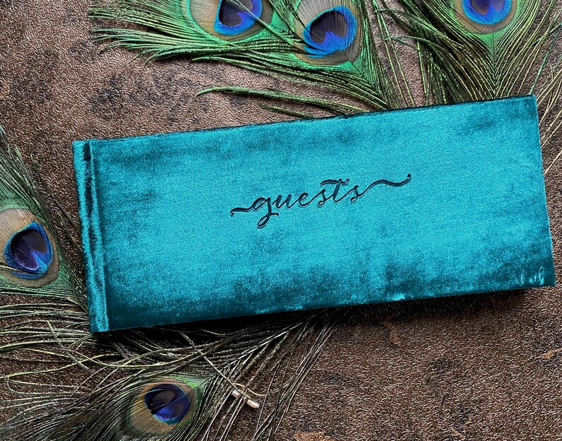 Small velvet guest book. 4x10 inches, landscape format. Soft velvet cover in a rich peacock green color. guests emblem stamped in center. Lined or blank page options available. Option to add name in corner for added cost. Intimate, small weddings