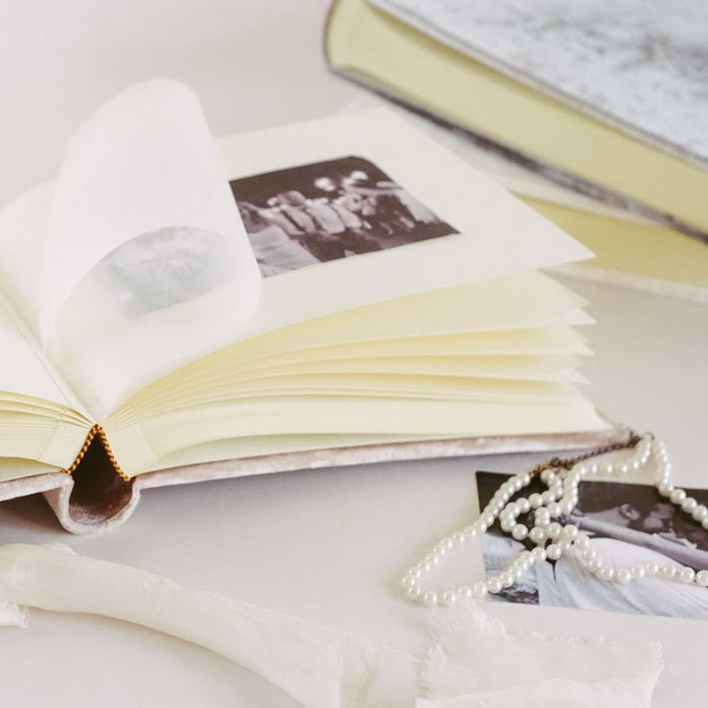 Cream, ivory, thick, matte paper pages. The paper is archival quality, acid free. Glassine interleaving in-between each page to protect photos from damage or touching the other side. You can attach photos with any photo safe adhesive