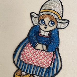 Antique dutch girl in her traditional costume applique