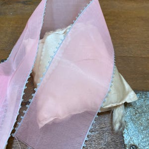 1 yd.of Pastel pink organdy ribbon with blue picot edge rayon, more