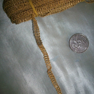 1 yard of a narrow metal antique gold trim,  more avail.  3/16&quot; wide