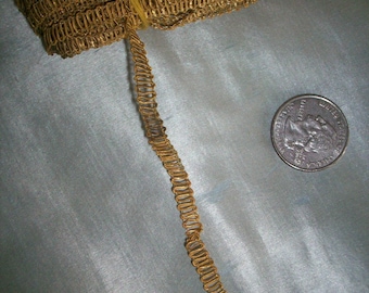 1 yard of a narrow metal antique gold trim,  more avail.  3/16" wide
