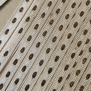 cream and gold metal French trim