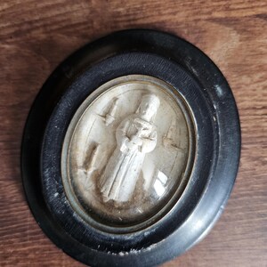 French antique Our Lady of Pontmain meerschaum in oval frame with domed glass.
