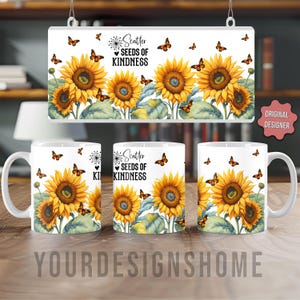 May include: White ceramic mugs and a decorative sign featuring a sunflower design with orange butterflies and the text "Scatter Seeds of Kindness." The mugs and sign have a floral theme.