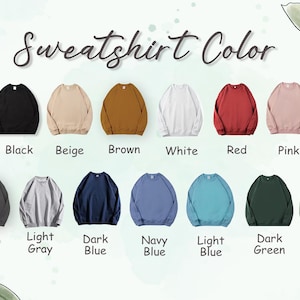 May include: A color chart displaying various sweatshirt colors. The options include black, beige, brown, white, red, pink, dark gray, light gray, dark blue, navy blue, light blue, dark green, and light green.