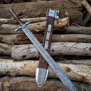 Angled view of a handcrafted Damascus steel Knight Templar Sword with scabbard highlighting detailed craftsmanship