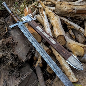Angled view of a handcrafted Damascus steel Knight Templar Sword with scabbard highlighting detailed craftsmanship